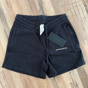 Alphalete Women's Essential Core Athletic Shorts in black cotton-blend materia